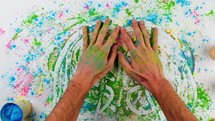Hands Of Man Touching Holi Colored Powder On White