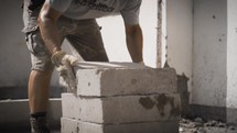 construction working lying mason blocks 