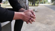 Man With Black Suit Is Sitting Pensively On The Track