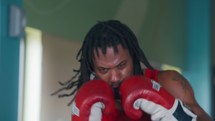 a boxer punching a punching bag 