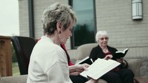 senior women discussing scripture at a Bible study 