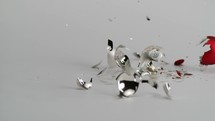 shattered Christmas ornaments on white background