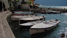 boats in a small port on lake garda