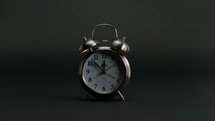 slow motion of a ringing alarm clock 