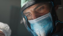 Doctor uses surgical face visor to avoid contagion
