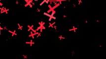 Particles of red religious crucifixes pass on the black background