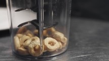 Chef is mixing breadcrumbs in a blender