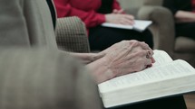 senior women discussing scripture at a Bible study 