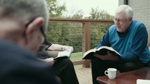 senior men having a Bible study 