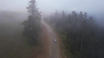 Cars on the foggy mountain road