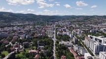 Aerial panorama of Banja Luka, capturing urban landmarks amid verdant surroundings