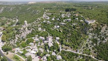Aerial orbit medieval city Pocitelj with mosque and castle, mountain panorama