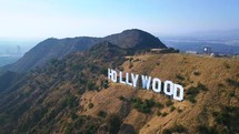 Cinematic aerial view of the Hollywood sign.