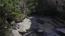 Drone flies upstream along river