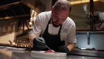 Chef serving a dish of raw tuna fillet for a cruise menu