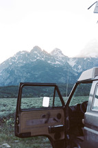 jagged mountains and parked van 