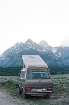 view of mountains and parked camper 