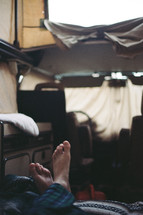 man sleeping in a camper 