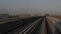 Riding the Dubai metro train in downtown city of Dubai in middle east.