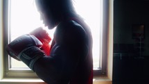 a boxer punching a punching bag 