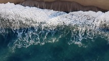Waves of stormy ocean overhead shot