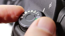 Setting mode dial lock button of the camera reflex - macro