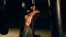man punching a punching bag in slow motion 
