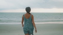 girl walking on a beach 