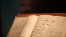 A Bible open to Genesis