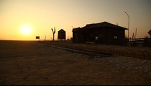 quiet train station in India at sunset 