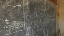 church and alphabet on a chalkboard in Kenya