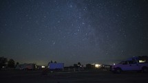 Timelapse of stars setting over a peaceful campground