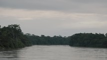 Amazon Rainforest And Lagoon Against Cloudy Sky In Ecuador - wide	