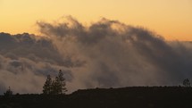 Timelapse of clouds in the mountains at sunset