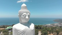 The Great Buddha of Phuket, seated Maravija Buddha statue in Phuket, Thailand. Pedestal shot 