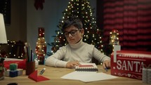 Child writing his Wish for Christmas 