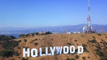 Cinematic aerial view of the Hollywood sign.