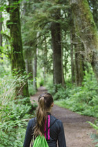 teenage girl hiking in the woods 