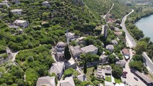 Aerial Overhead View Of Sisman Ibrahim Pasha Mosque In Historic Village Settlement Of Pocitelj. Orbit Motion Shot