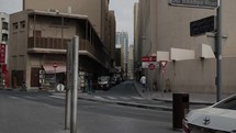 Cinematic, slow motion shot of buildings and street in Old Dubai.