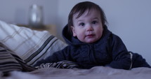Toddler boy smiles at camera - slow motion
