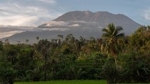 The Mighty Mount Agung of Bali Indonesia and Lush Green Rice Field - Beautiful Volcano Landscape Nature Time Lapse