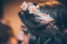 A young woman with a band of flowers in her hair.