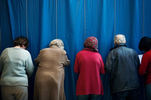 Voters voting in polling place