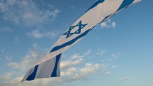 Waving Israel Flag on blue sky