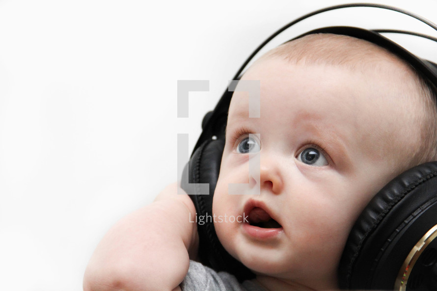 infant boy wearing headphones 