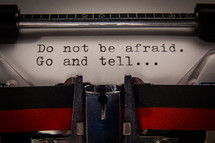 Excerpt from Matthew 28:10, "Do not be afraid. Go and tell...", text typed out on a vintage typewriter.
