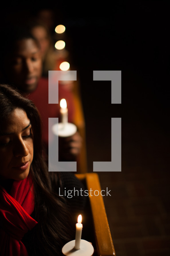 Parishioners holding candles at a Christmas Eve Service 