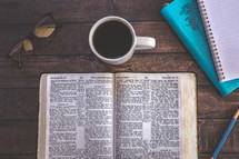 opened Bible and coffee