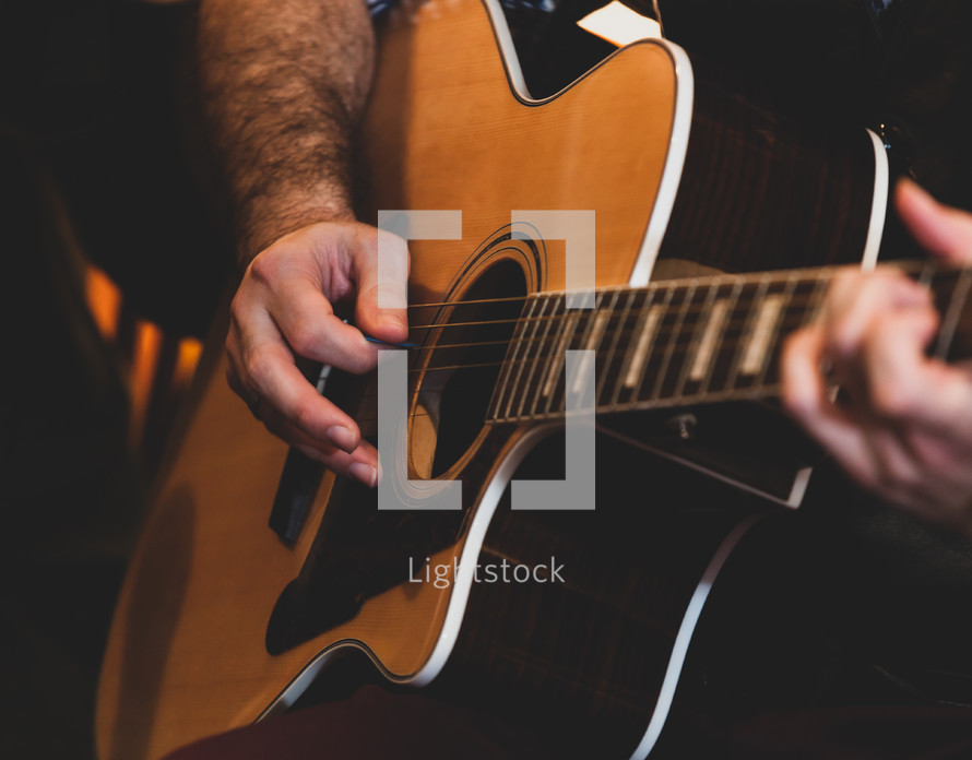 hands playing classic guitar. Selective focus.